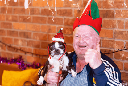 Jim and his dog Minnie in Christmas hats
