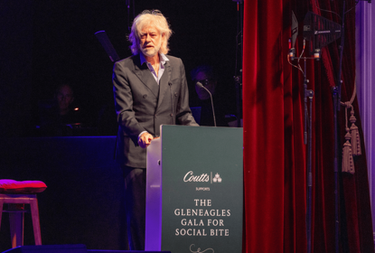Bob Geldof speaks at a lectern that reads The Gleneagles Gala for Social Bite
